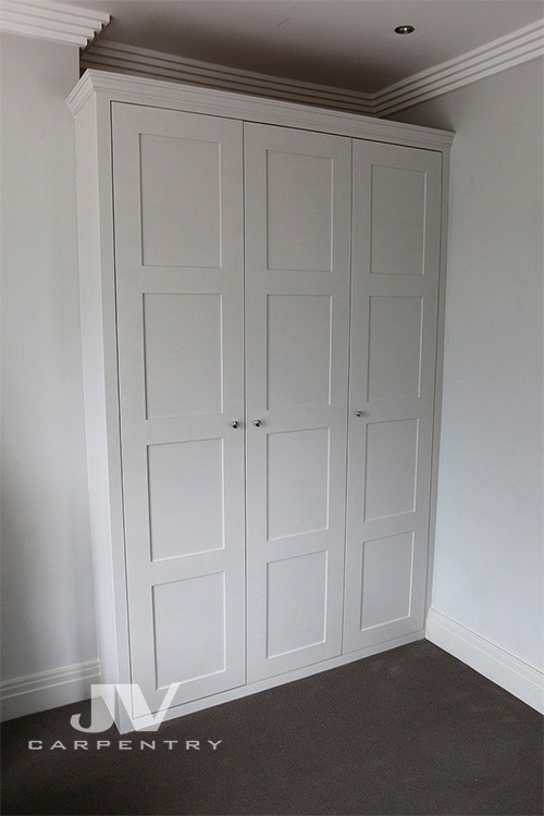 Fitted wardrobe with panneled doors
