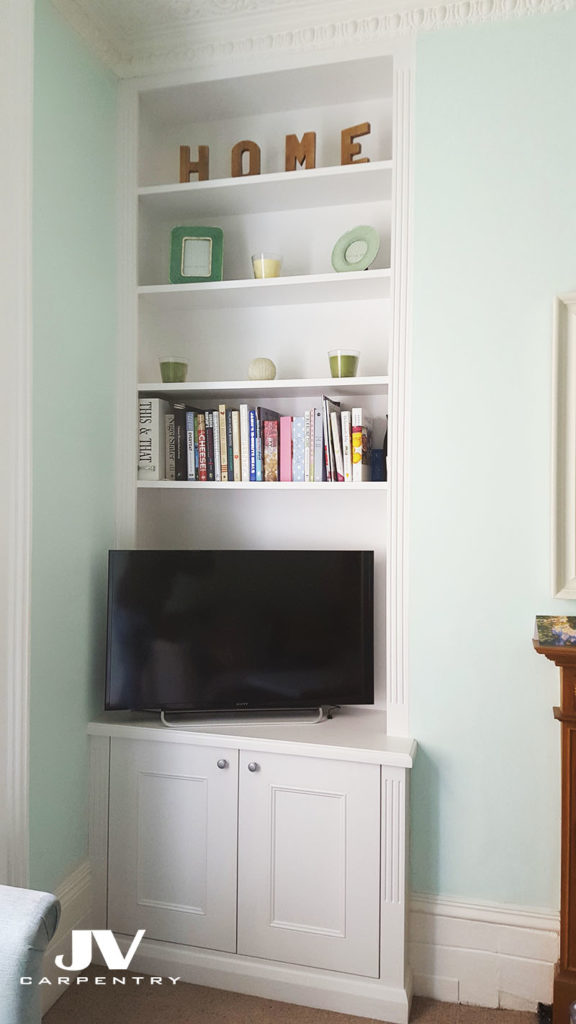 Fitted alcove bookshelves with cabinet at the bottom, victorian style