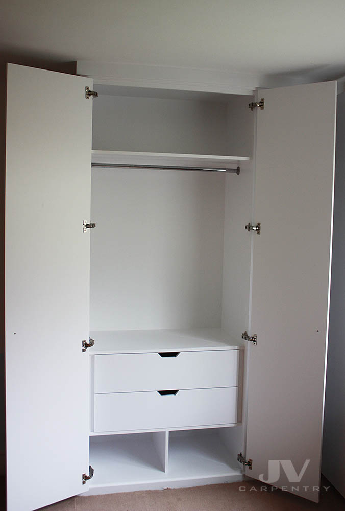 Bespoke fitted wardrobe with open doors