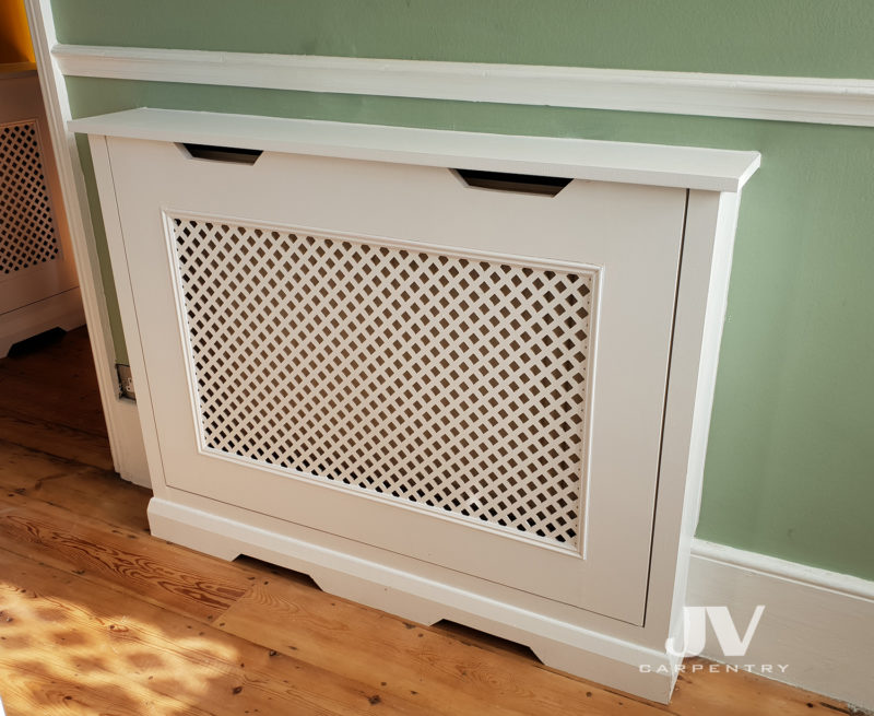 Bespoke radiator cover fitted in the hallway. It's not only hiding the radiator with beautiful piece of fitted furniture, it also give you an extra shelving space and protect your kids for burning their hands