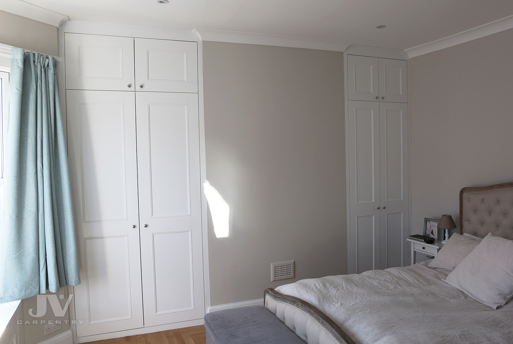 two alcove fitted wardrobes either side of the chimney