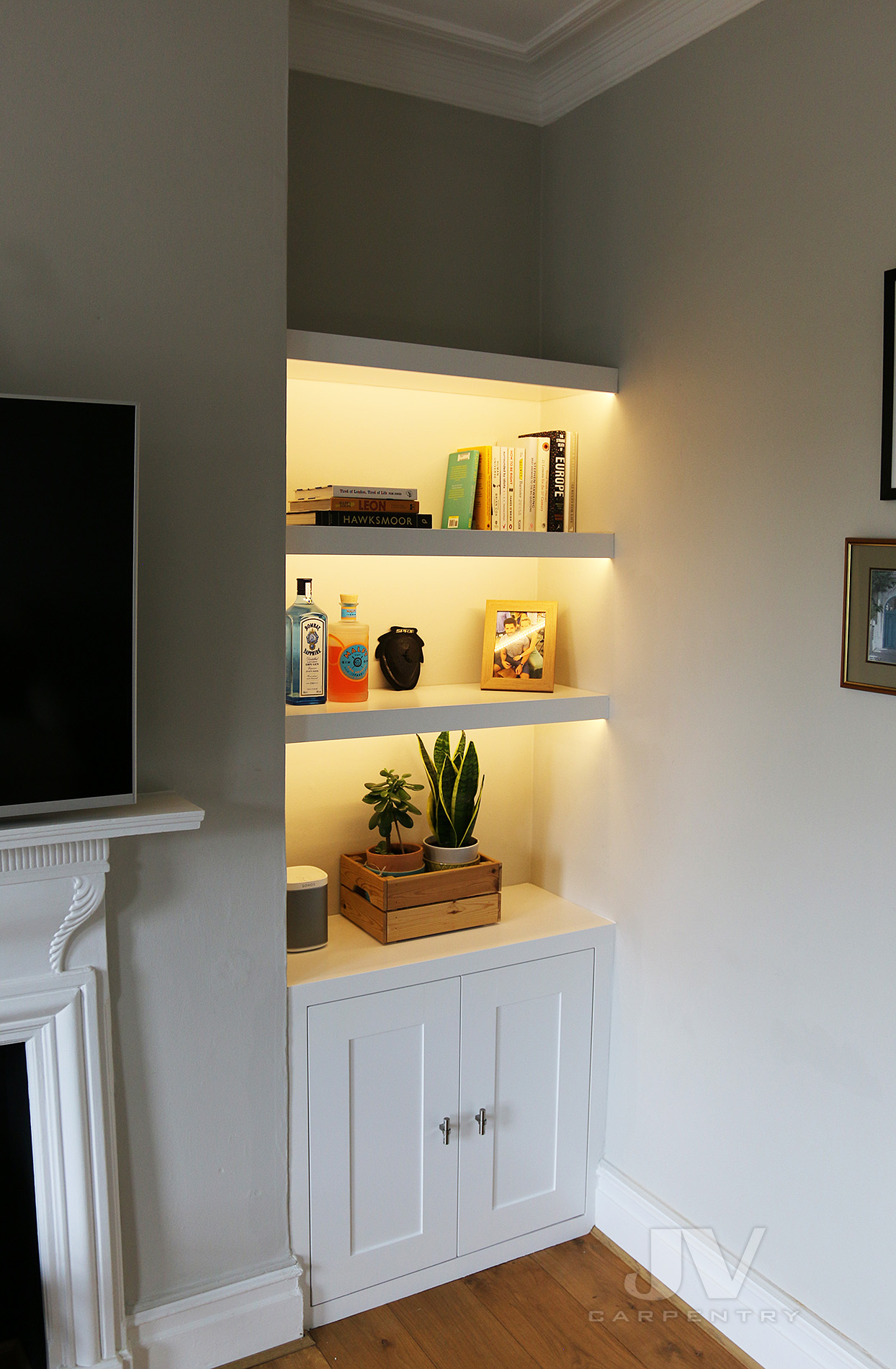 Alcove Shelves with Lights and Cabinets in the Living room 