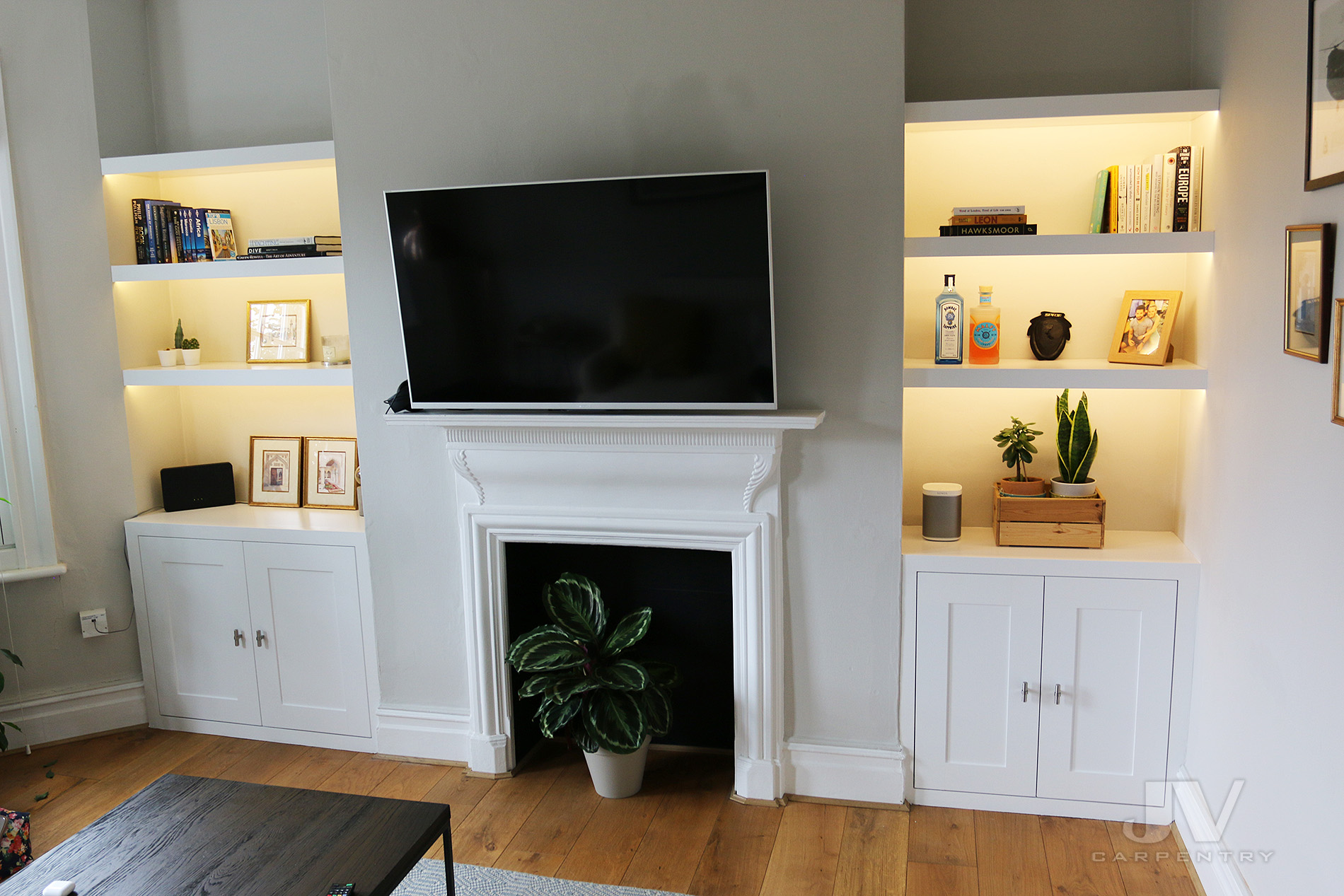 Alcove Shelves with Lights and Cabinets in the Living room 