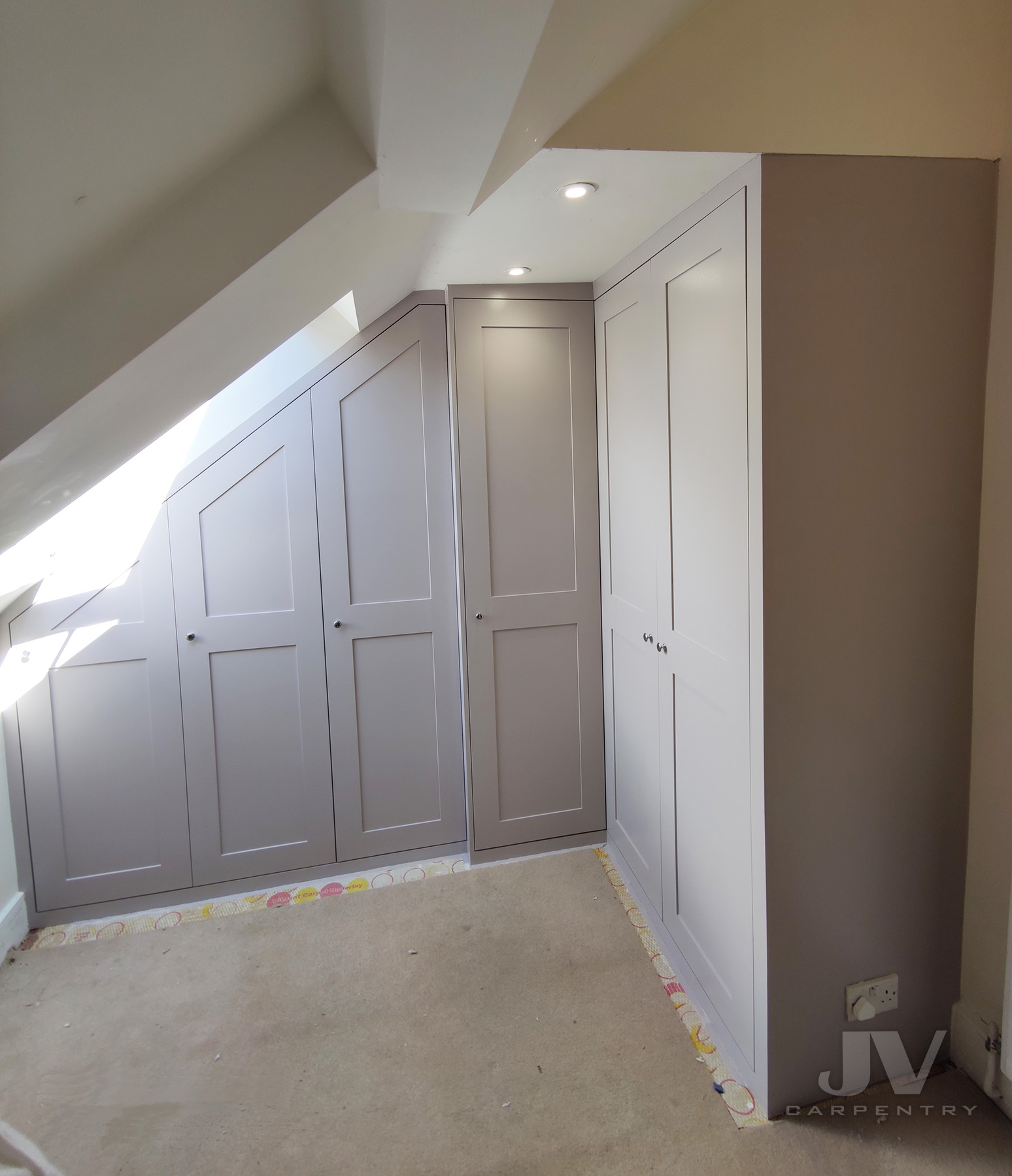 L-shaped fitted wardrobes in the Loft