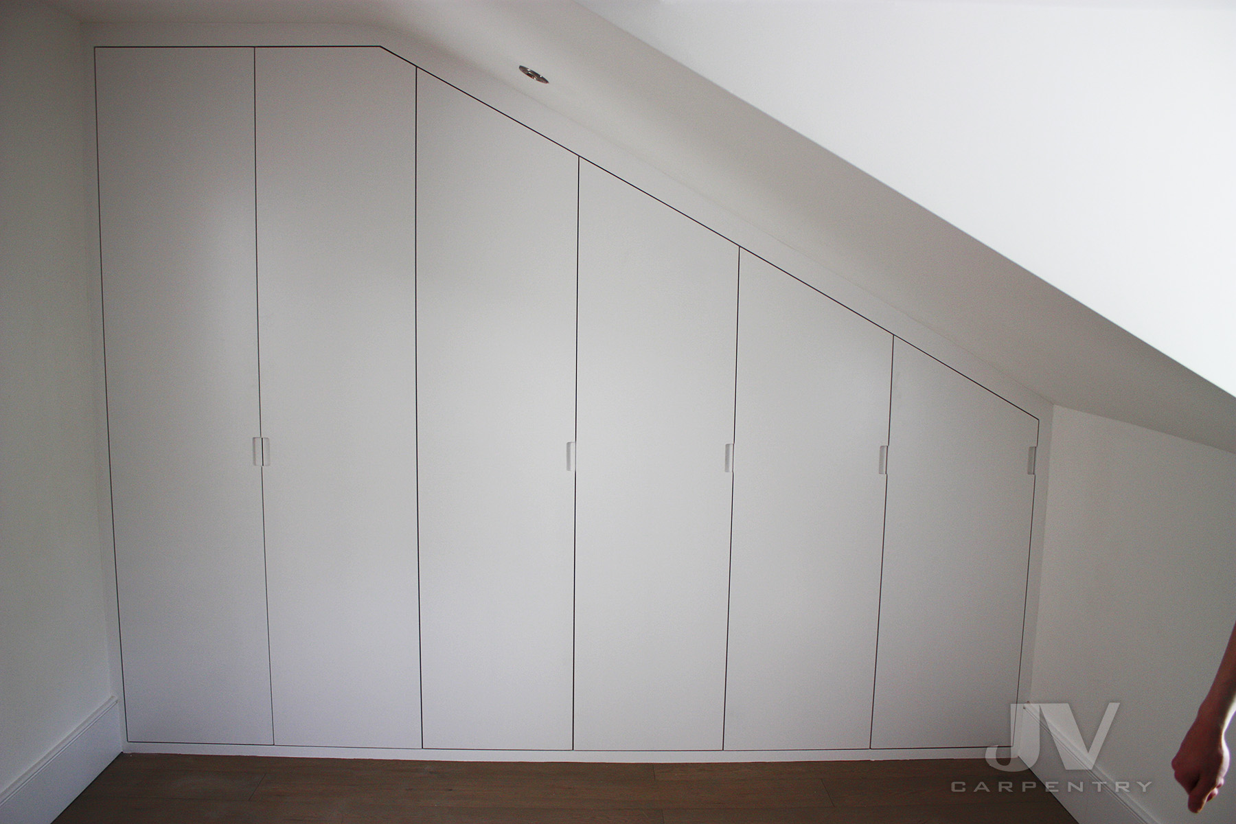 Plain wardrobe in loft bedroom