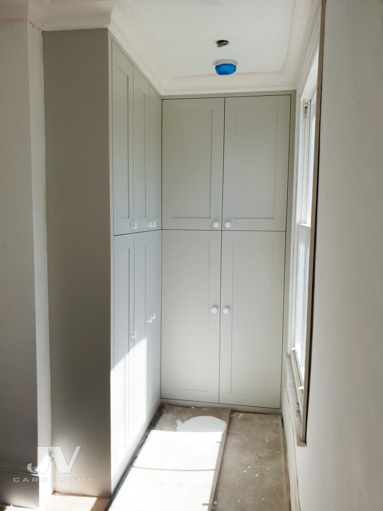 Builtin wardrobe around the window Ideas JV Carpentry