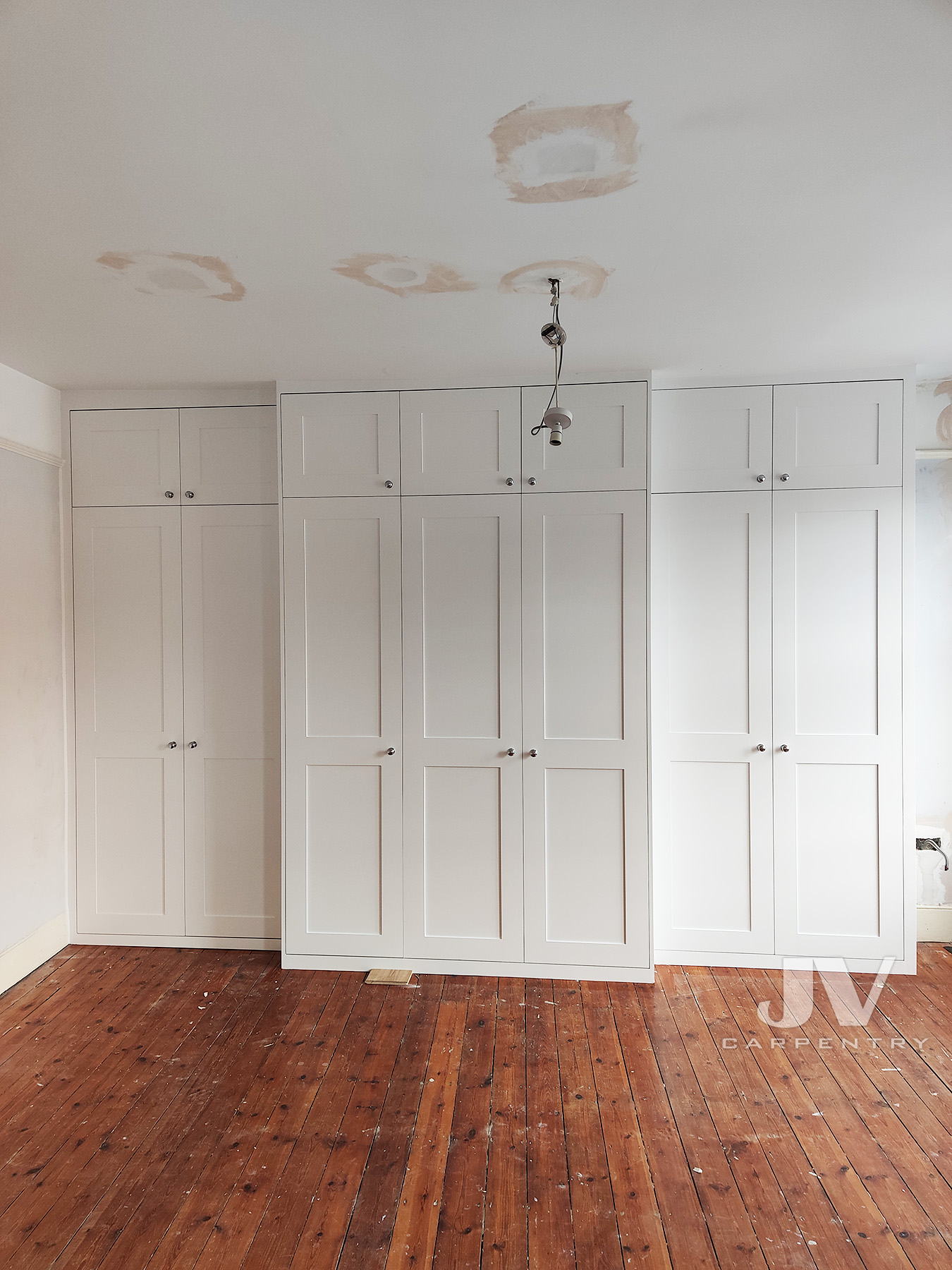 fitted wardrobe around chimney in Ealing