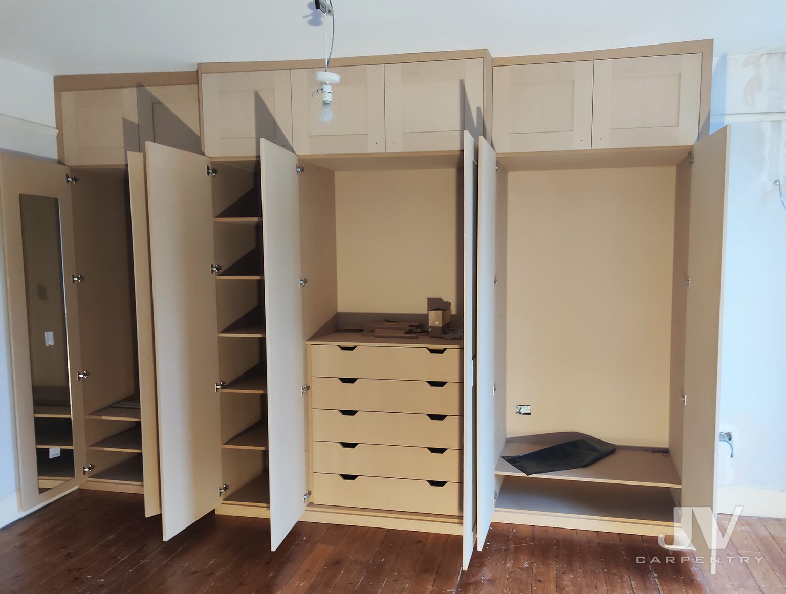 Fitted wardrobes around chimney breast JV Carpentry