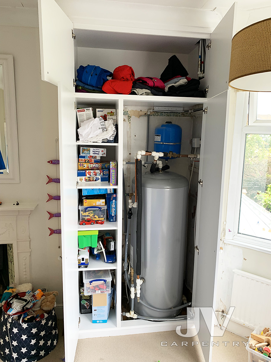 Boiler tank inside wardrobe, Wimbledon