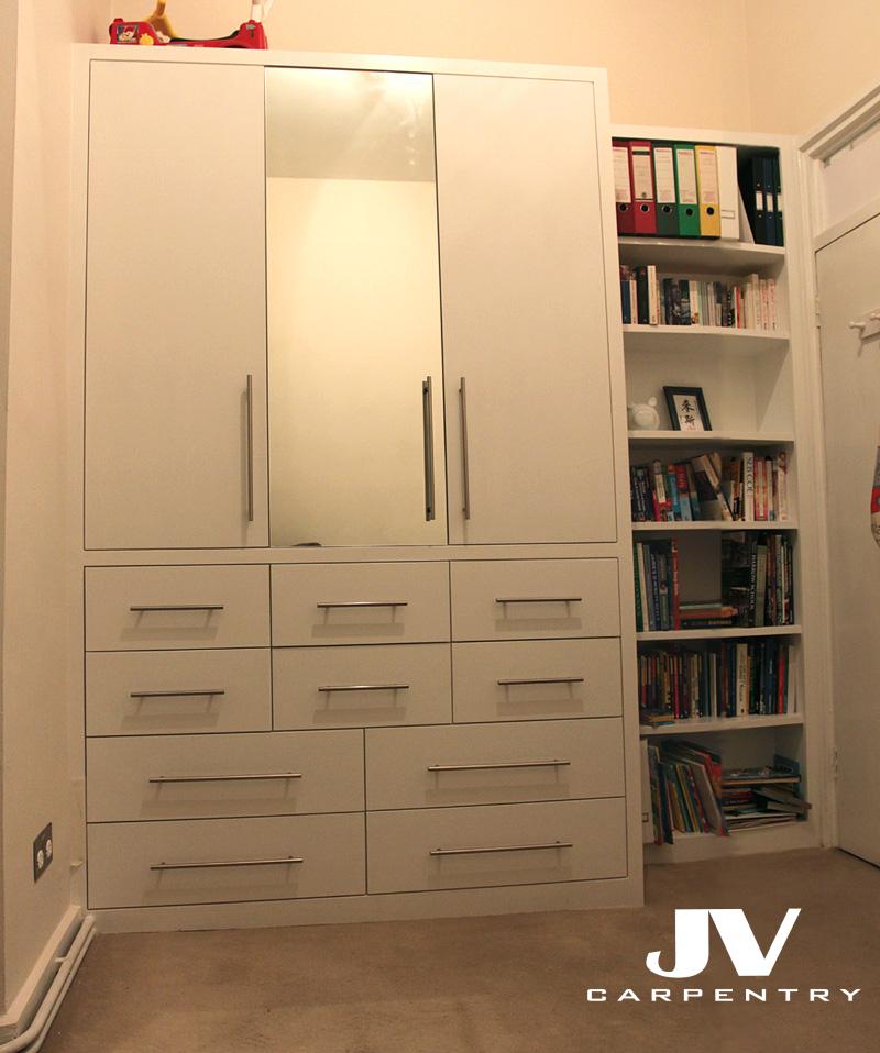 Wardrobe with mirrored doors and bookshelves