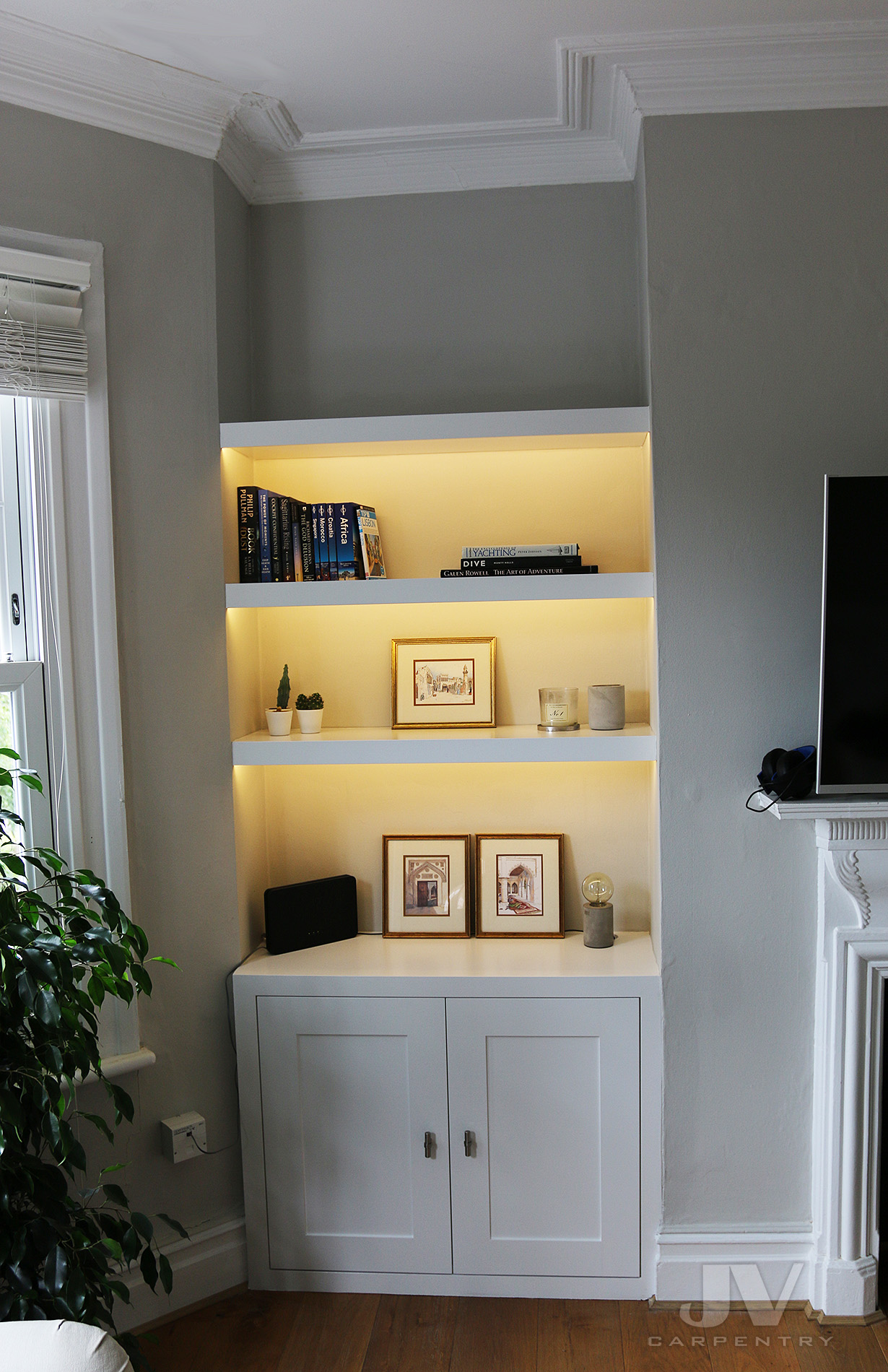 Alcove cupboards and bookshelves with lights