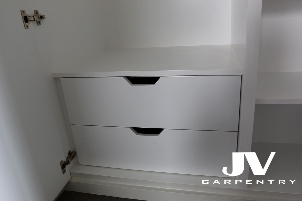 drawers inside fitted wardrobe painted in white