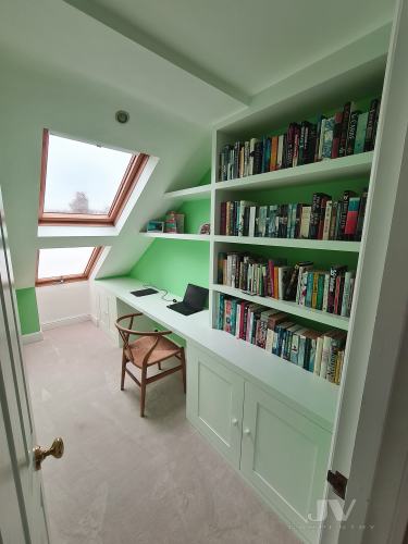 Loft bookshelves with desk space