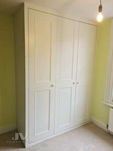 Fitted wardrobe with three doors
