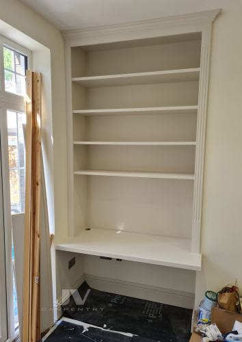 Alcove shelving with desk space