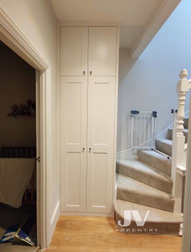 Fitted wardrobe by the staircase