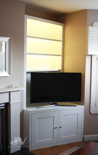 Alcove fitted bookshelves light on