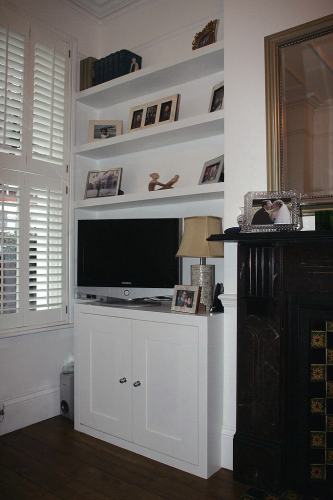Alcove floating shelves and cabinet below