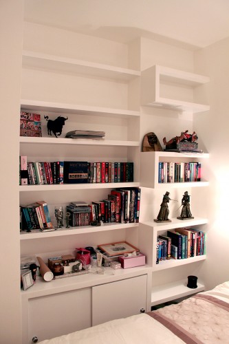 Floating shelves on the wall with cabinet