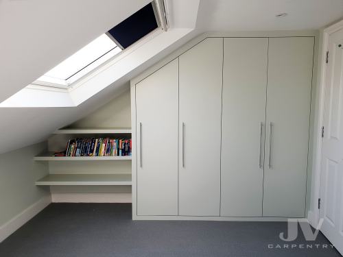 Fitted loft wardrobe with floating shelvesand three floating shelves on the side