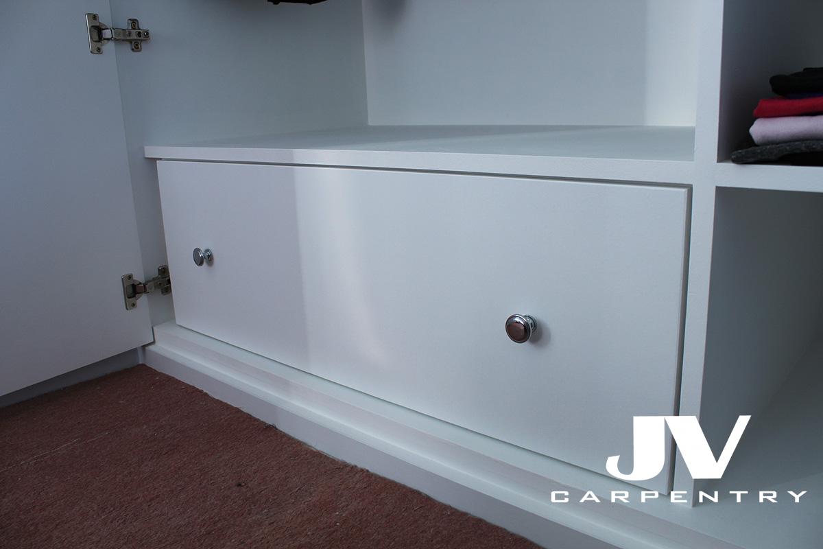 drawer inside fitted wardrobe, painted white with shelf above