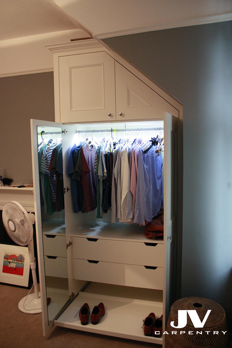 Wardrobe interior: Shoe rack cost £70, drawers cost £100/each